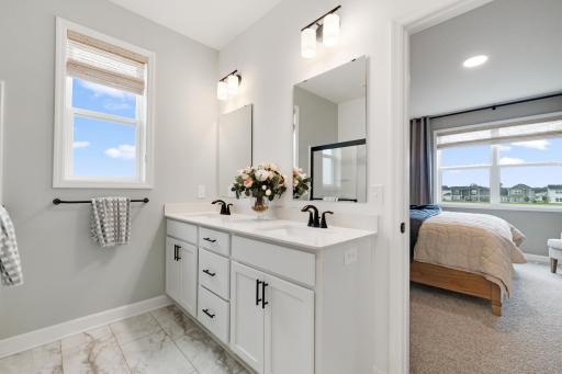 (Photo of a decorated model, actual home's finishes will vary slightly)