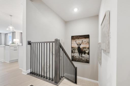(Photo of a decorated model, actual home's finishes will vary slightly)