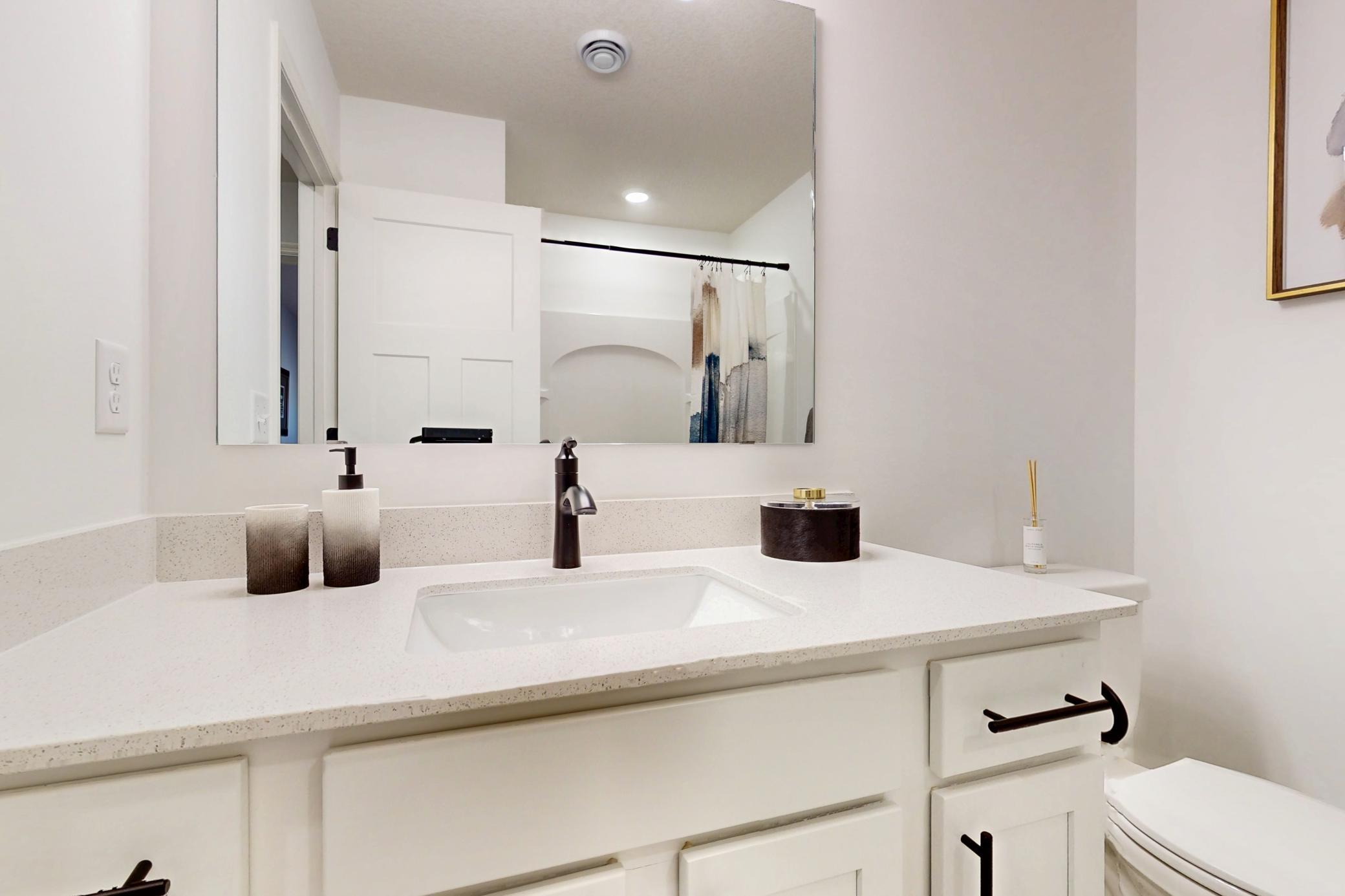 (Photo of a decorated model, actual home's finishes will vary slightly)