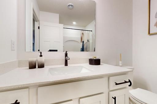 (Photo of a decorated model, actual home's finishes will vary slightly)