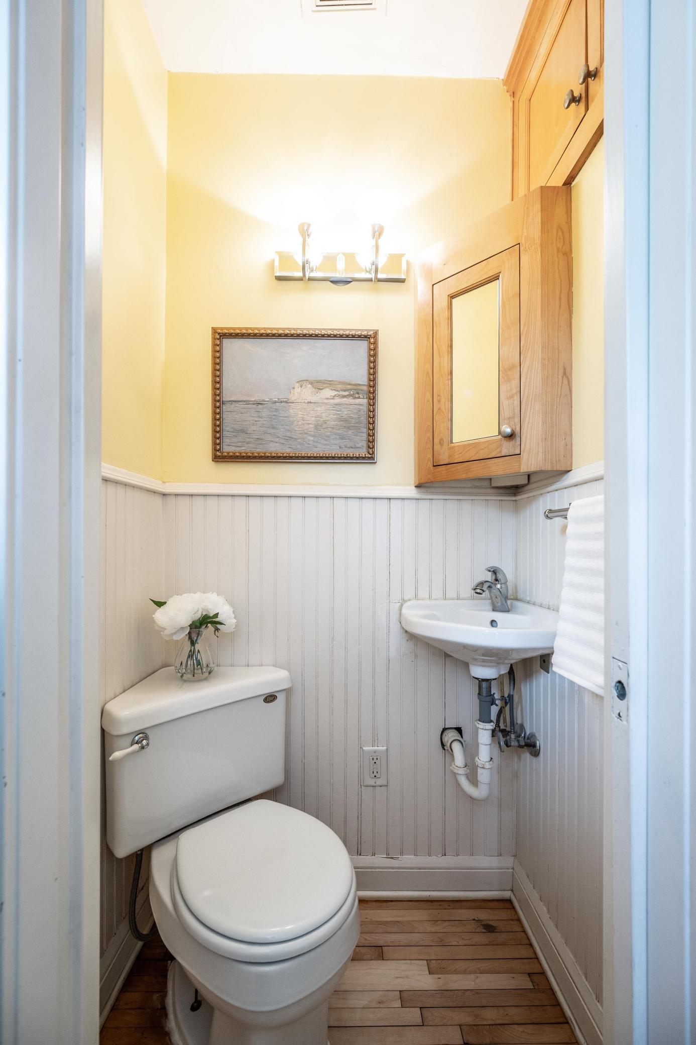 1/2 bath around the corner from the kitchen