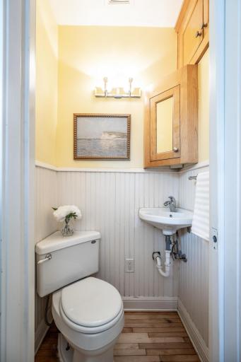 1/2 bath around the corner from the kitchen