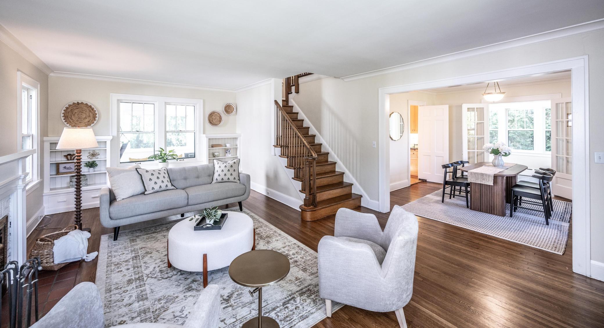 Living room opens to the formal dining room