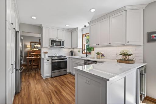 Easy living is this nicely updated kitchen with all the amenities, don't miss the built-in wine chiller in the penisula!