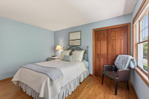 This bedroom supports a full size bed, nightstand, dresser, accent chair and reach-in closet.