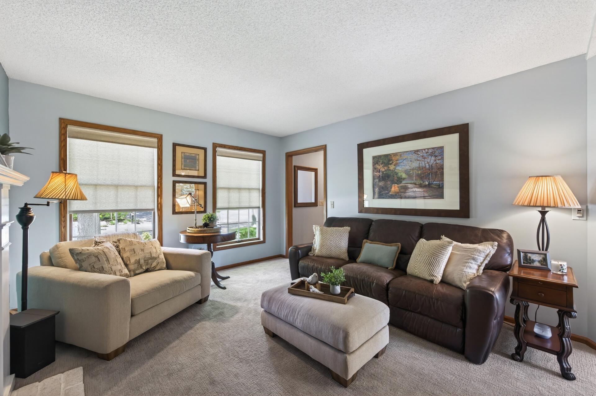 The main floor also includes this cozy family room with more beautiful views out the front