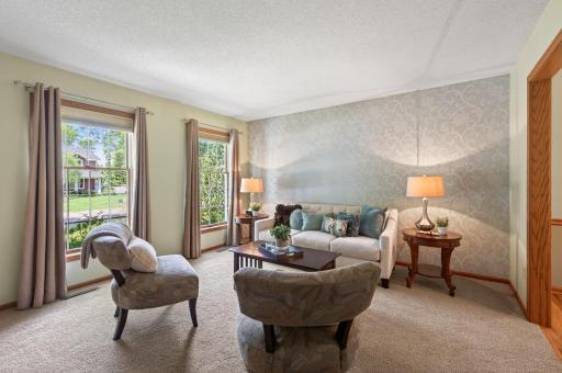 Main floor front living room is generously sized and allows for furniture arrangement options