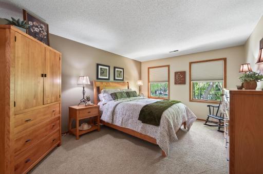 This upper level primary suite is huge to allow for plenty of furniture configurations and bright views to the frontyard.