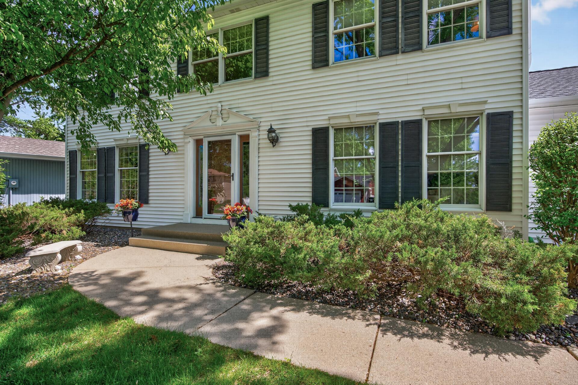 Welcoming front entry with great condition concrete path