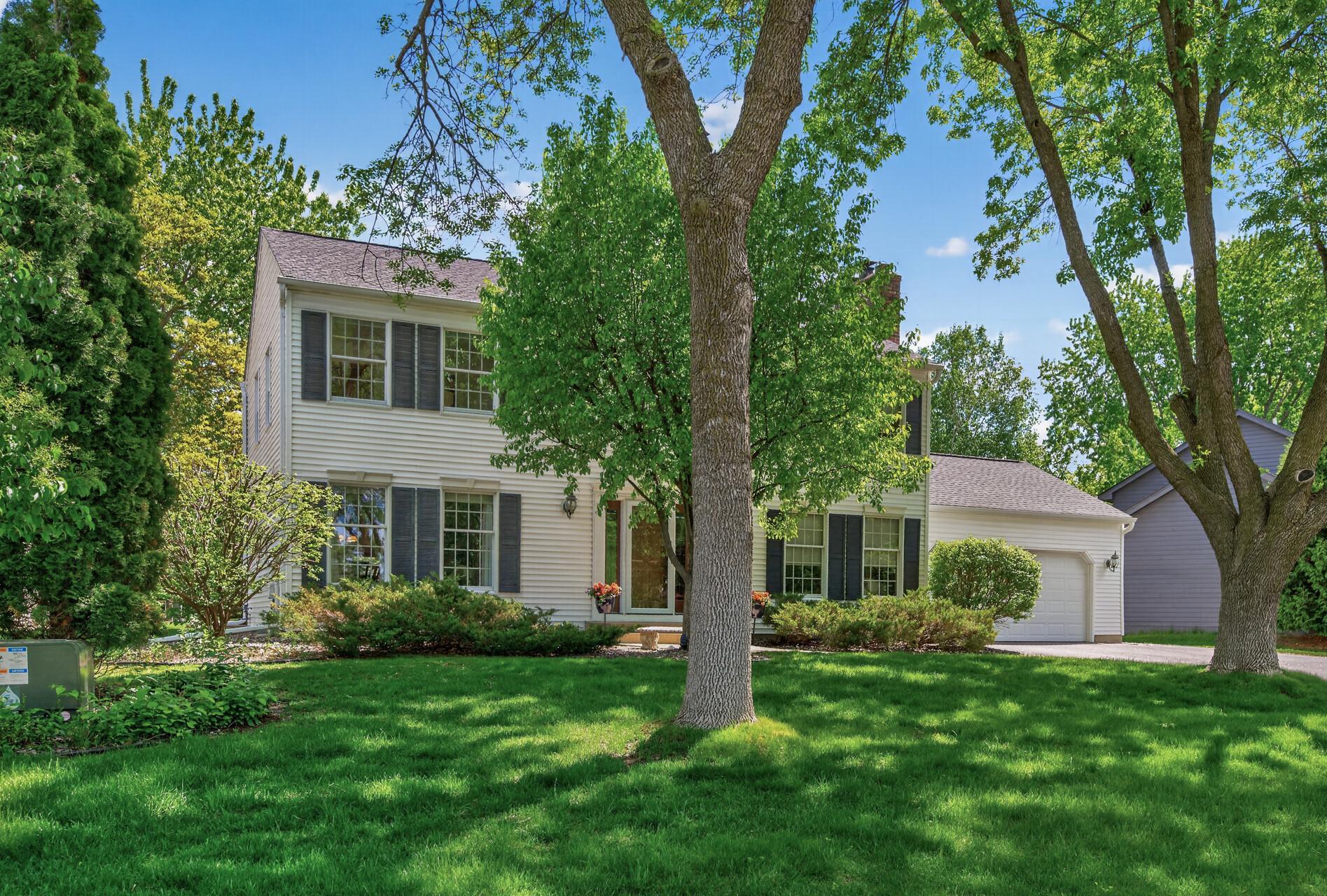 Classic Two-Story homes nestled under mature trees and beautiful landscaping