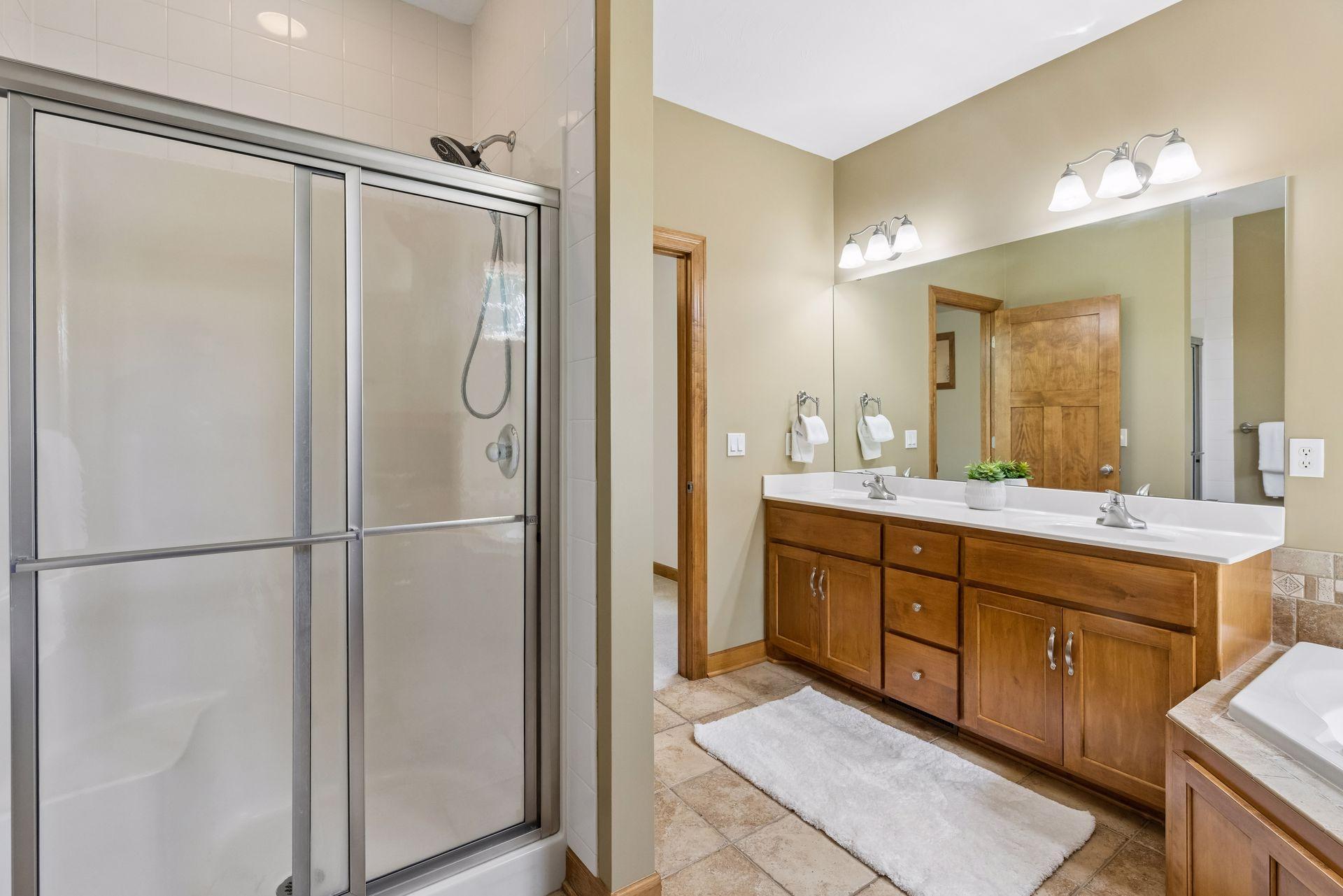 Primary bathroom shower. New white quartz countertop to be installed June 2026.