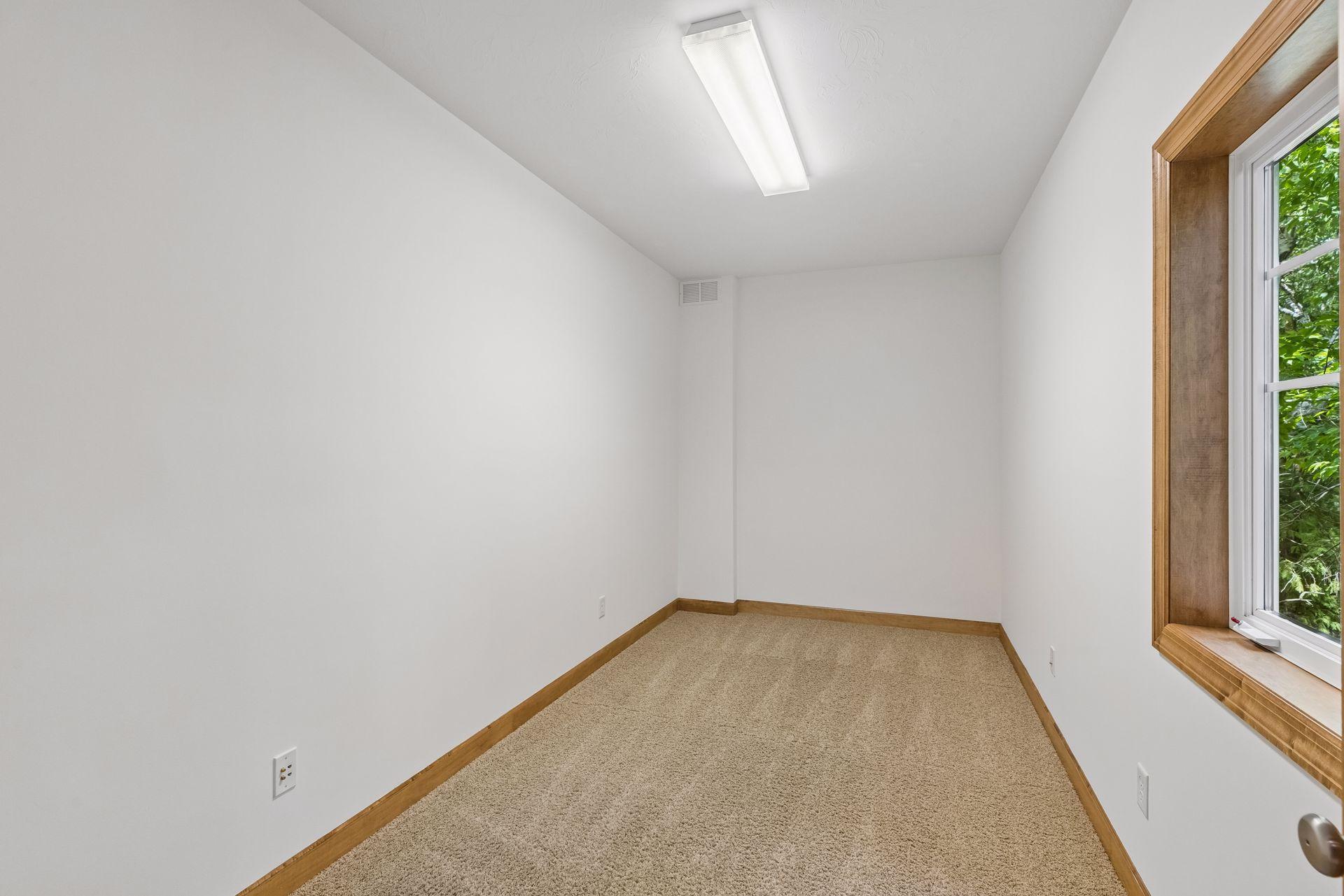 This room was used as a music room. Office space, den, storage or maybe a craft room?