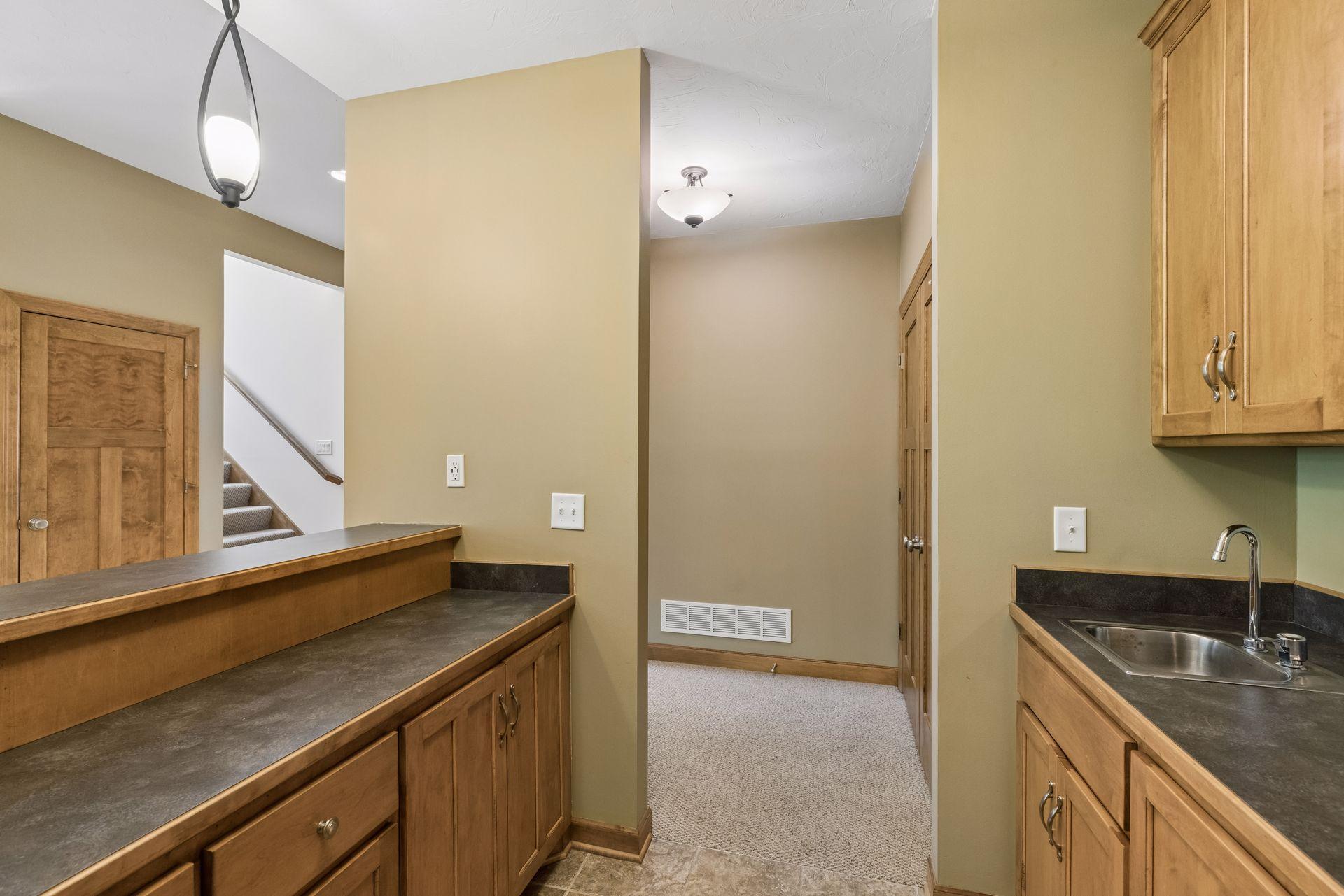 Lots of cabinetry and storage in the bar area.