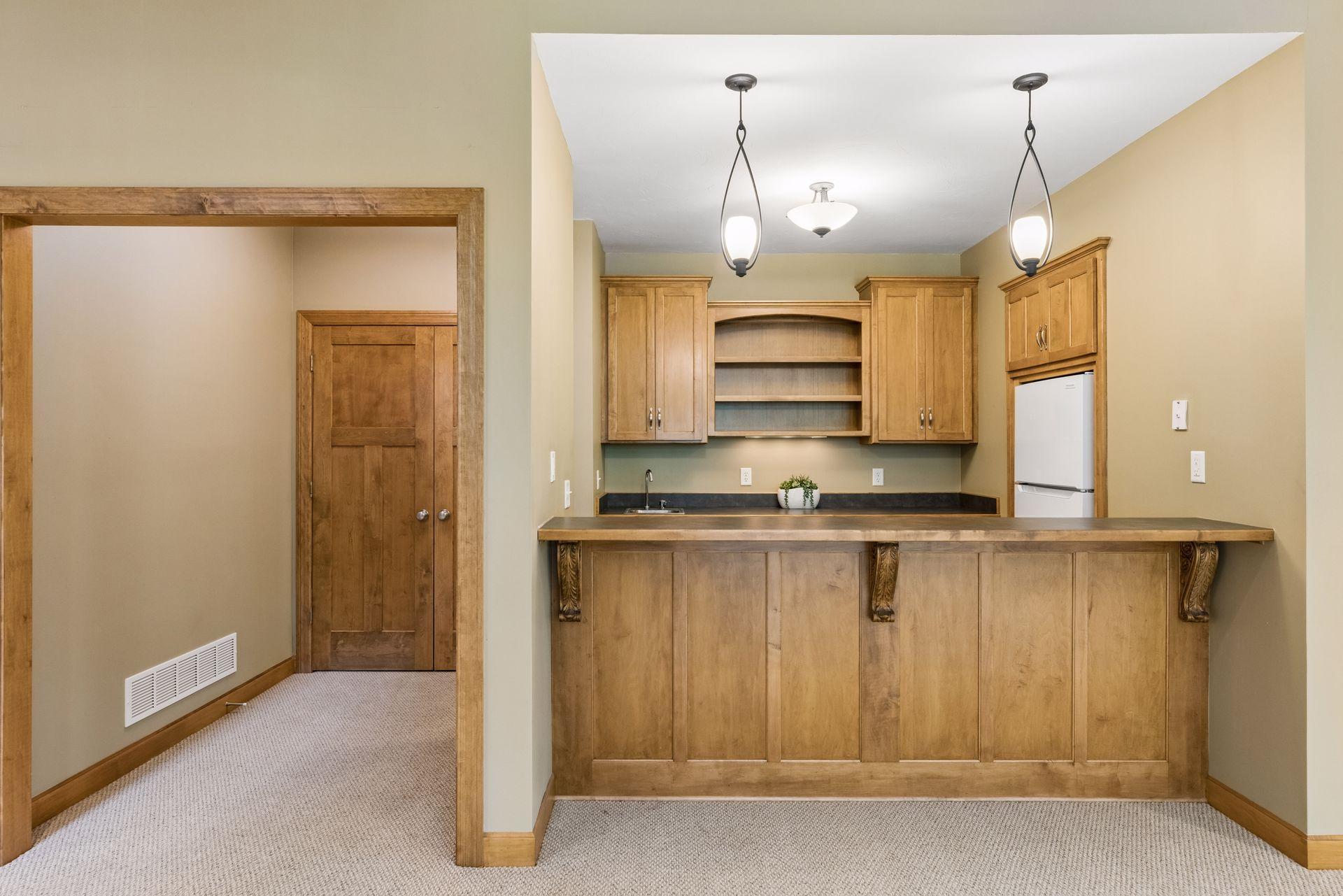 Perfect setup for entertaining! New refrigerator, microwave and small bar sink. Closet to the left.