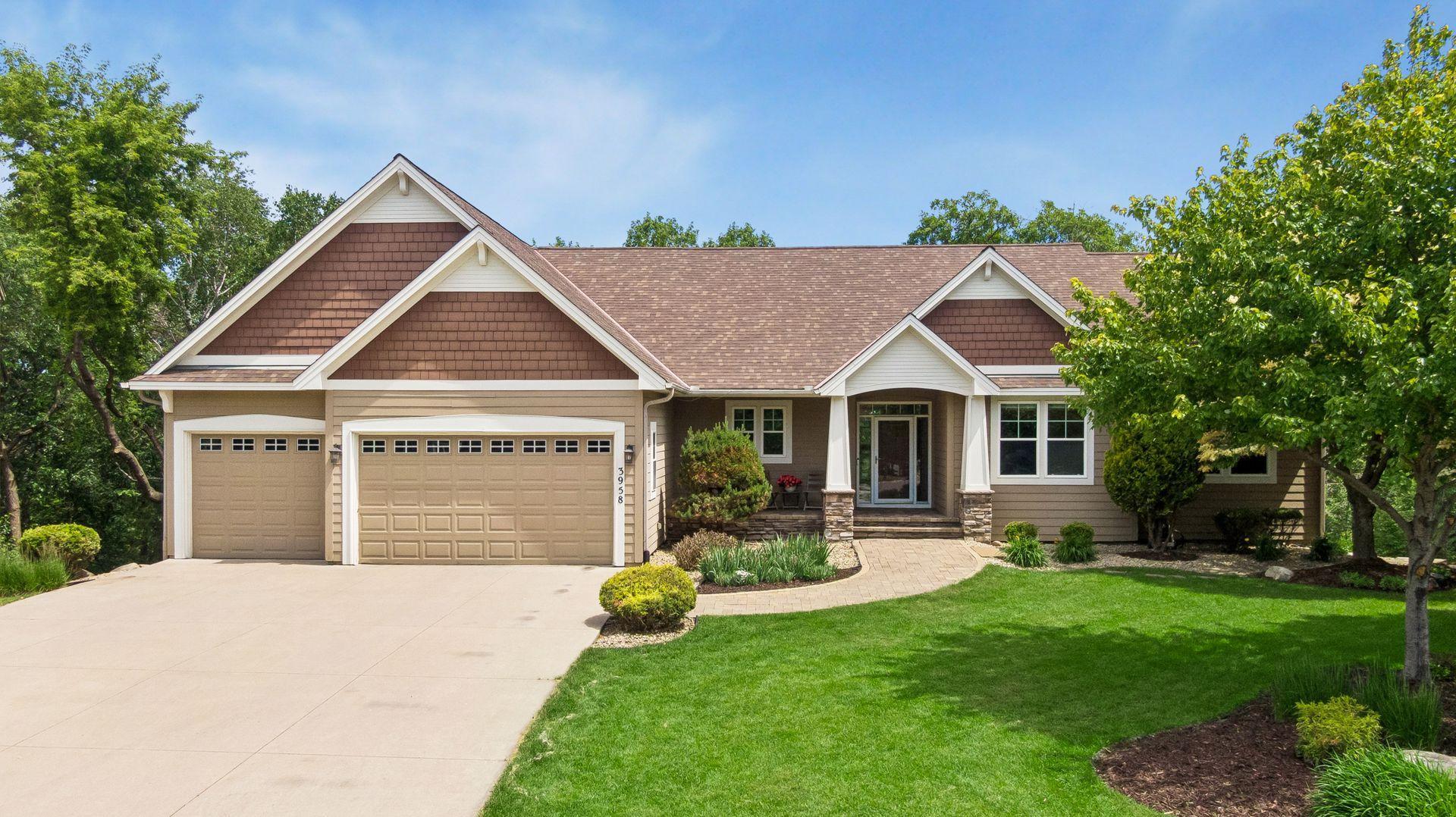 Nestled on a nearly one-acre cul-de-sac lot with a private wooded backdrop, this custom-built executive walkout rambler offers exceptional living and entertaining spaces both inside and out.