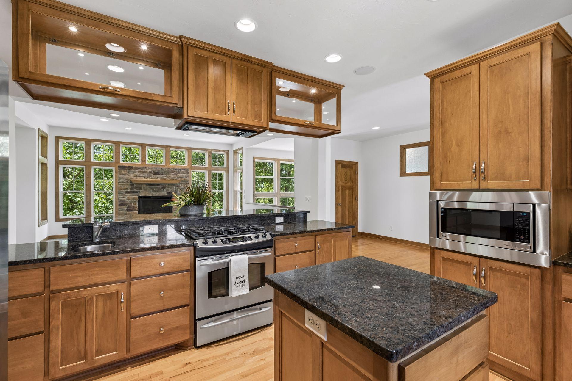 Gorgeous cabinets with Maple floors and cabinets, granite countertops, abundance of cabinets and stainless appliances.