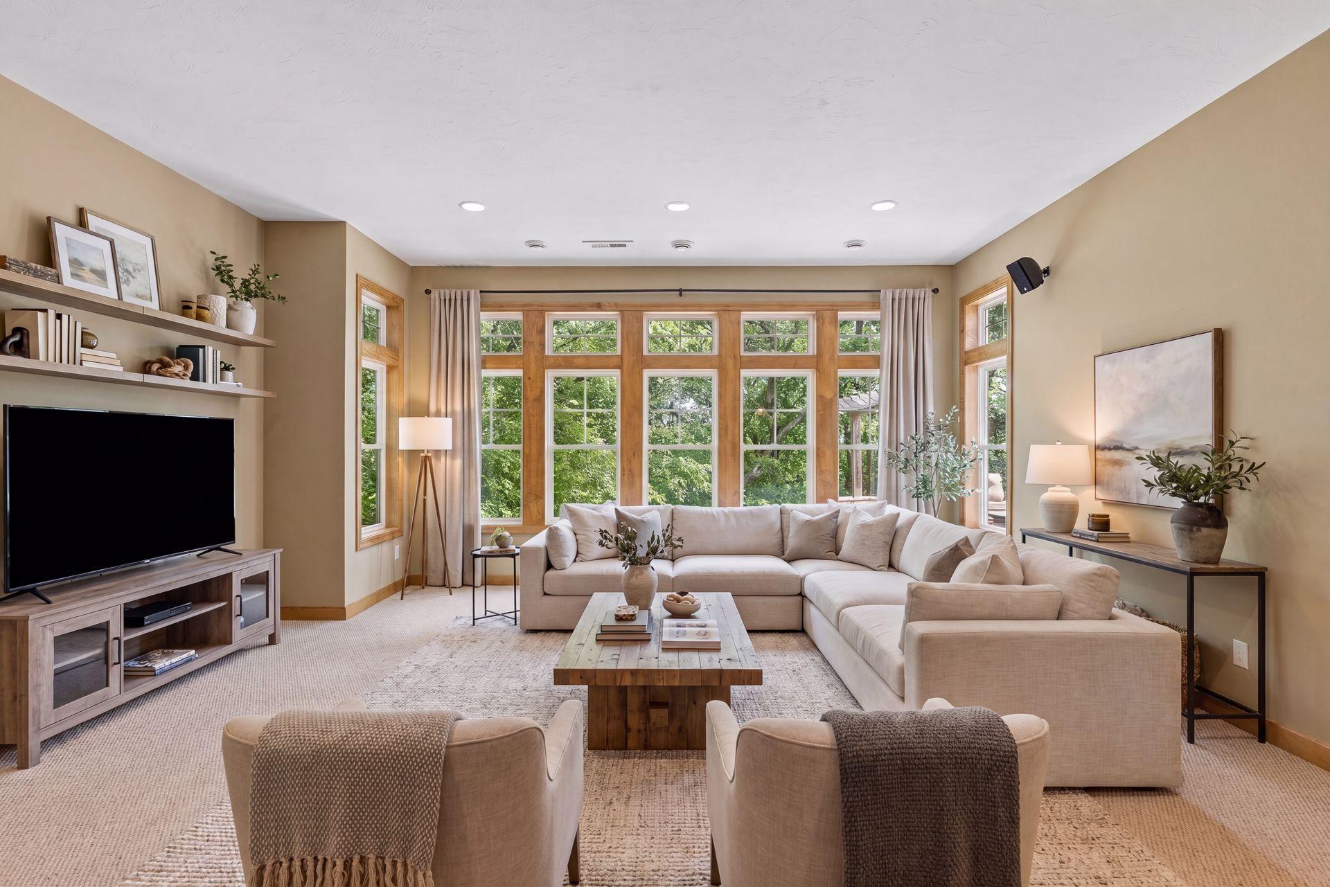 The lower level family room and amusement space has 10 ft ceilings and a wall of windows.