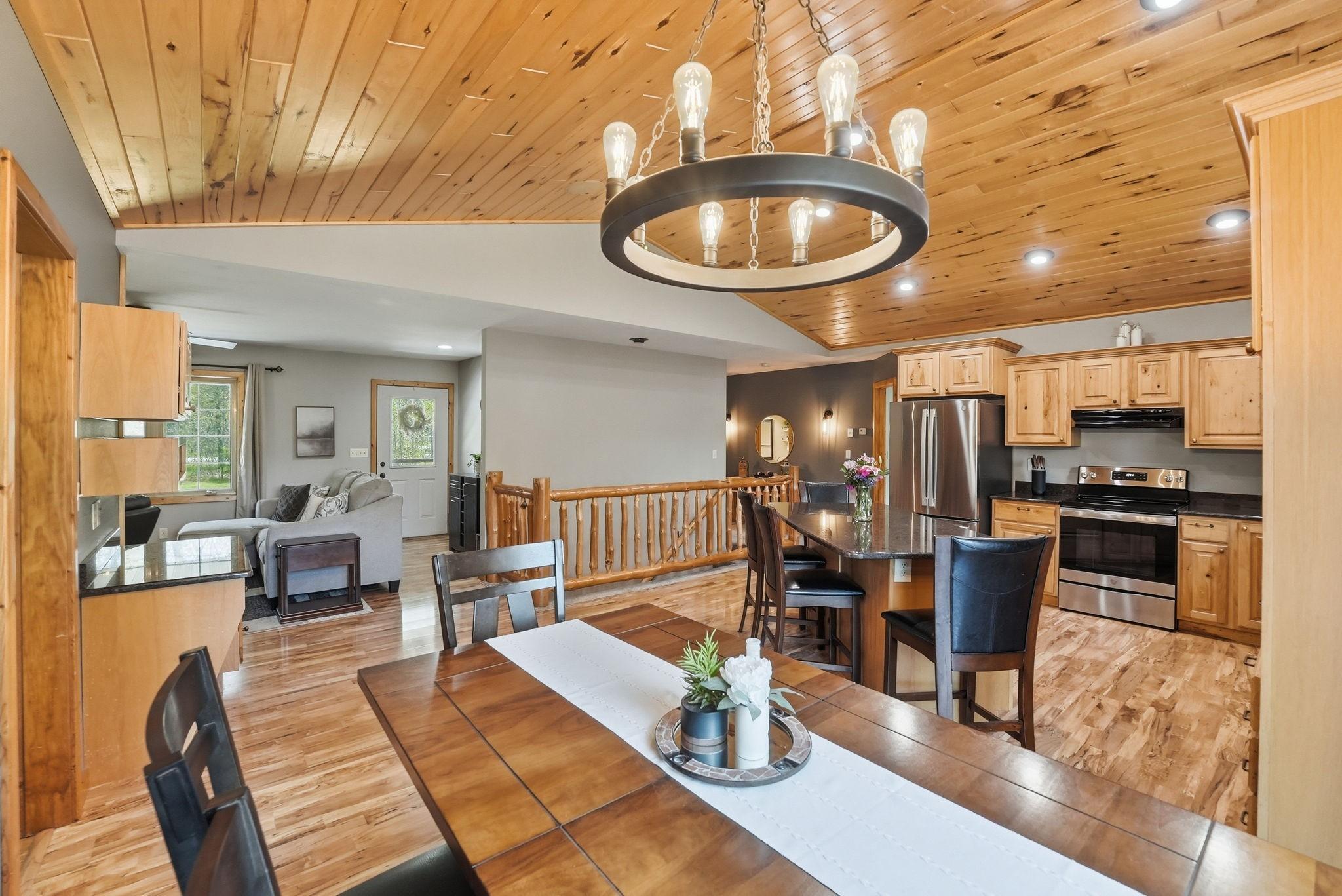 This space is open concept! Eat in kitchen-informal dining room with vaulted ceilings. Open to living room area. Sliding glass door leads to deck with views of private backyard!