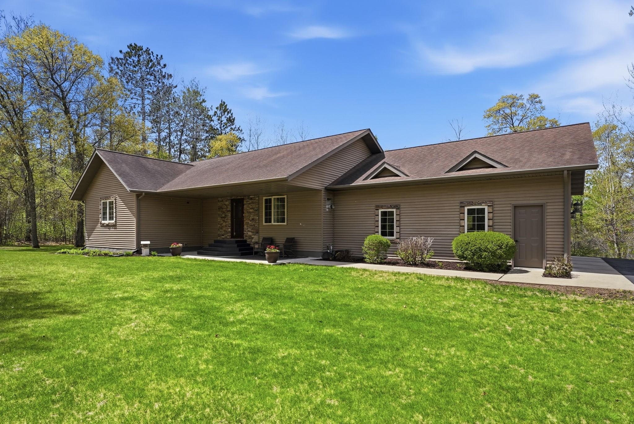 Beautiful 4 bdrm, 4 bath walkout rambler on just under 5 acres!