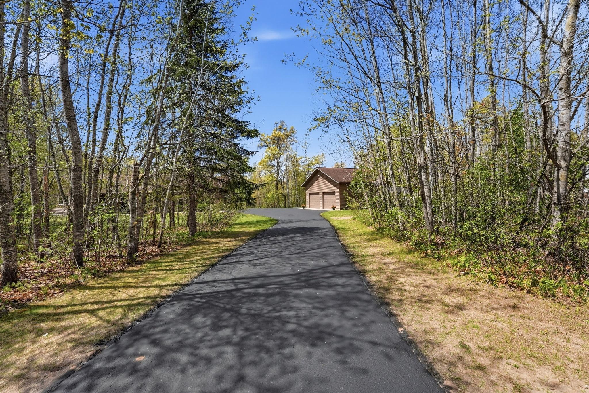 Private Setting! Newly resurfaced asphalt driveway