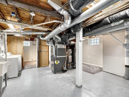 Additional unfinished space provides bonus storage space and the epoxy floors add comfort.