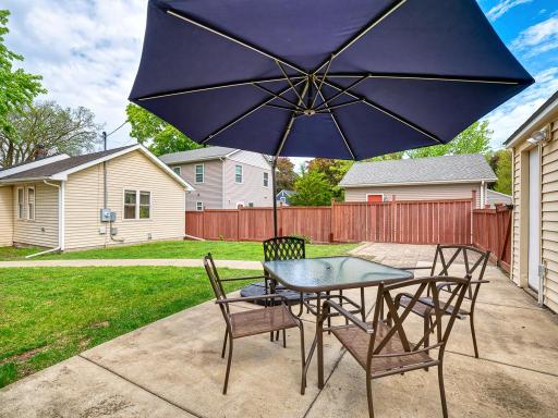 A generous patio perfect for summer gatherings, gardening, or simply relaxing outdoors.