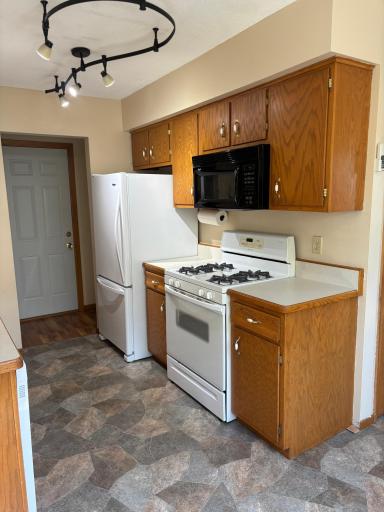 Gas stove, upgraded refrigerator with bottom freezer.