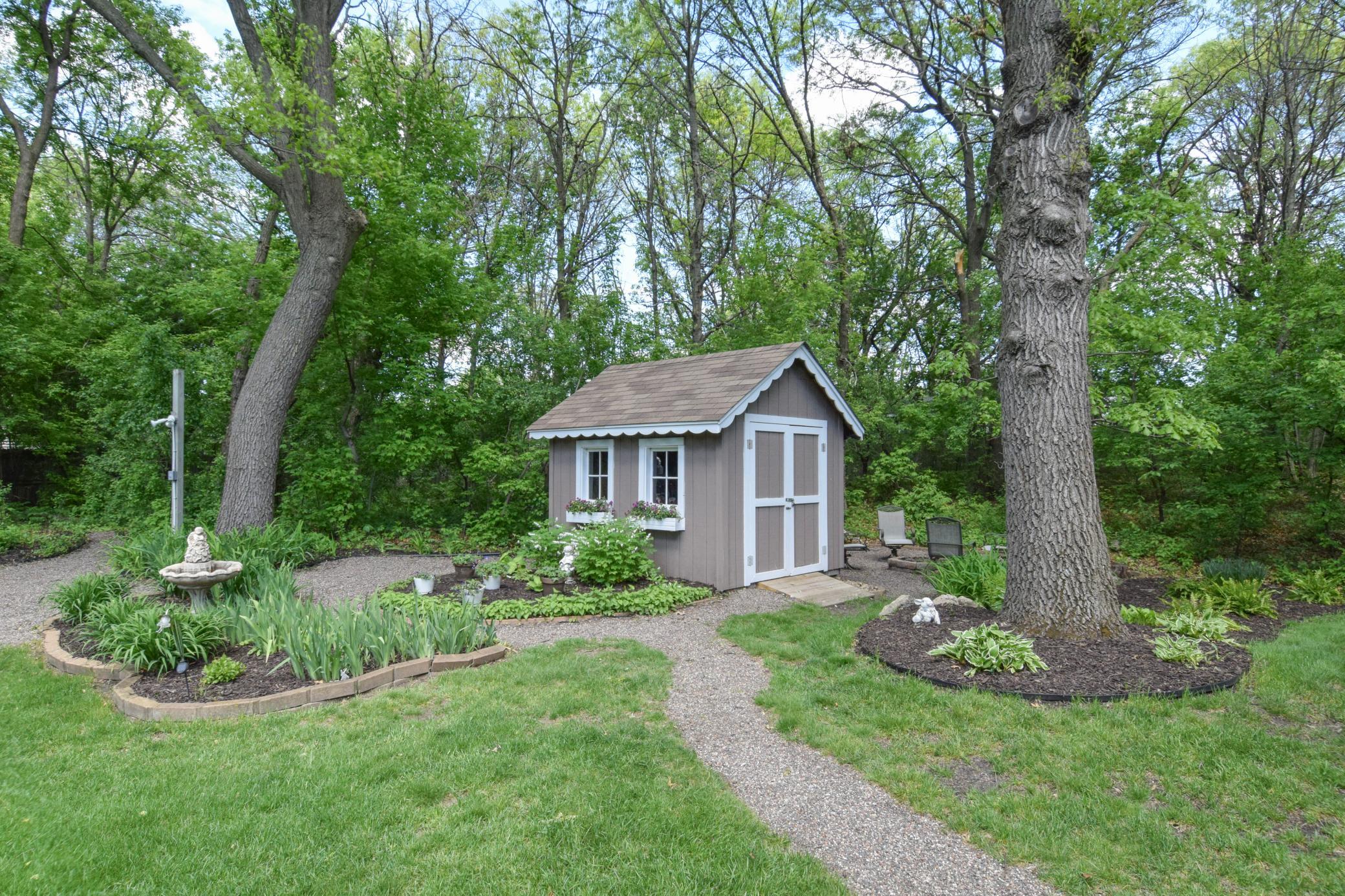 Meander From the Green Carpet Like Yard to the Magical Wooded Area That Feels Like a True Fairy Garden! What Use Do You Have for This ADORABLE Shed?