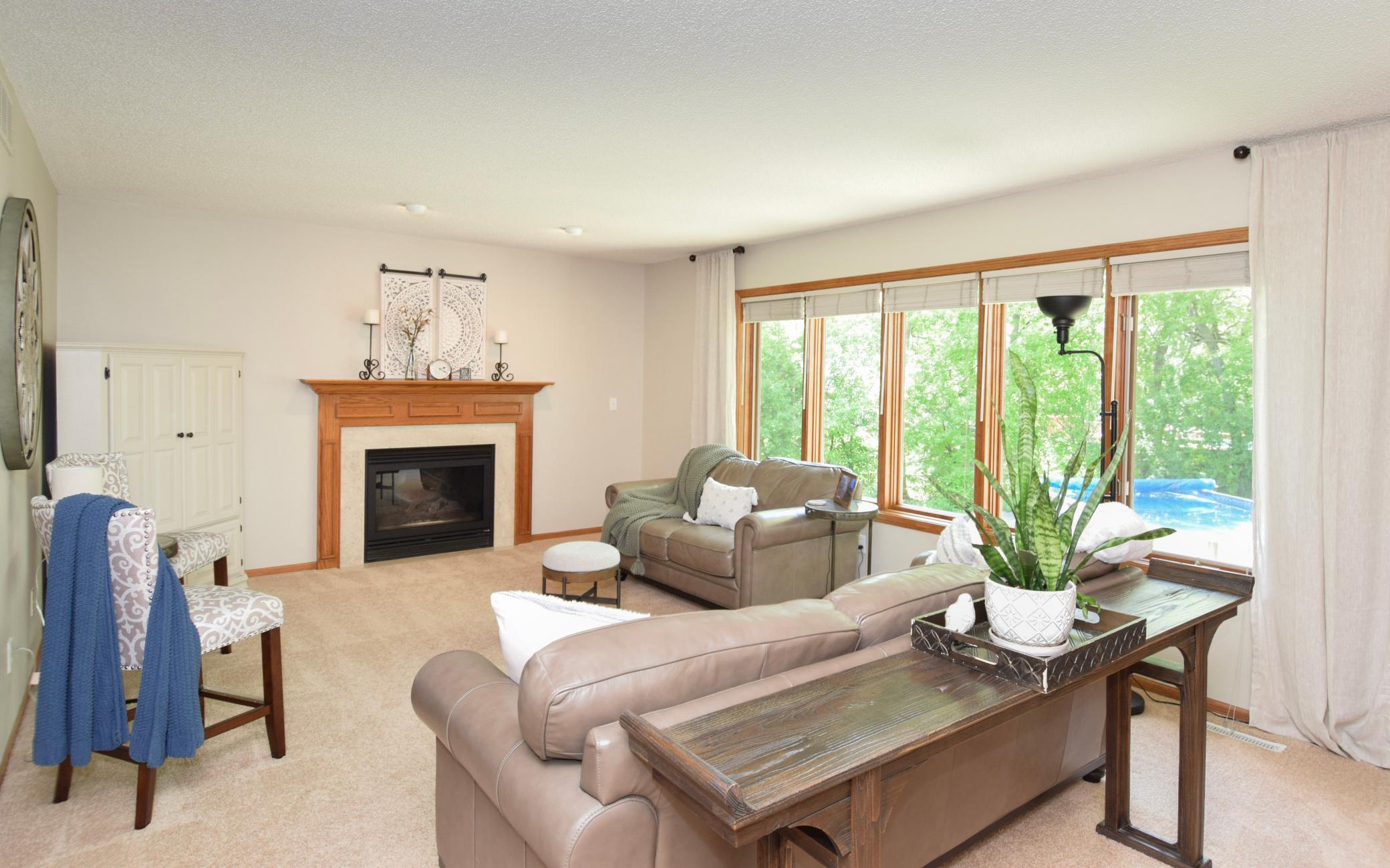 See the Pool From the Enormous Main Level Family Room! Watch the Kids or the Adults Act Like Kids Through the Wall of Windows Here! Beautiful Gas Fireplace for Cooler Months!
