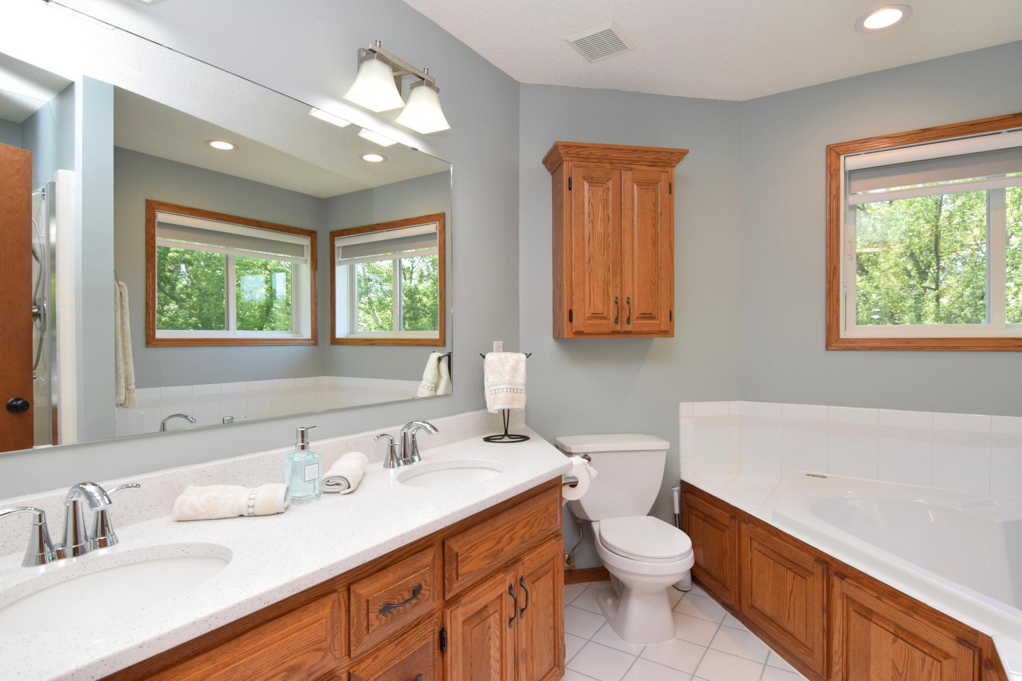Ahhhh...This SPA LIKE Primary Bath! You Must Experience the Colors-Wrapping You in Clean and Crisp! New Fixtures and Shower Door! You Can't Miss the Breathtaking NEW GORGEOUS Quartzite Top!