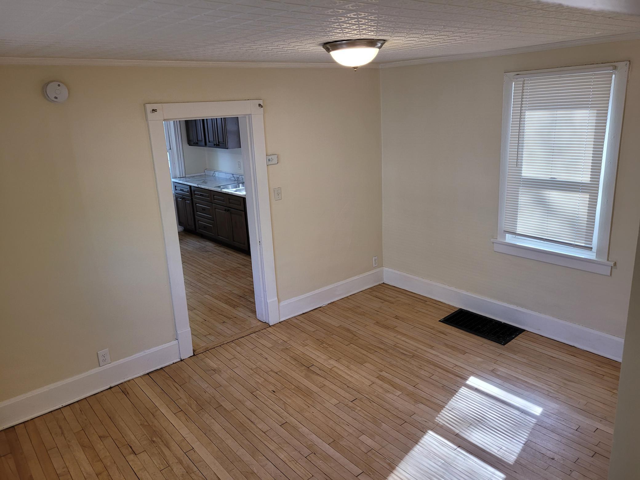 Dining room has hardwood floors.