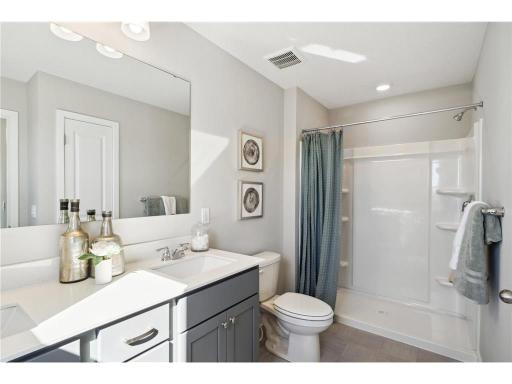 Ensuite bathroom features a double sink and walk in shower