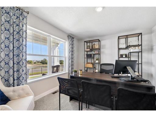 Office on the main level with a view to the front yard