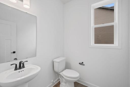 (All the following photos are of a similar home, actual finishes may vary.) This powder room is located on the the main floor, making it more convenient to accommodate guests and family members.