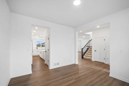 The breakfast room provides a convenient spot for casual meals and friendly conversations between the kitchen and family room.