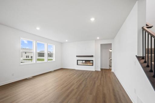 Enjoy shared moments with loved ones in the comfortable and spacious Great Room, where expansive windows flood the space with natural light.