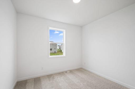 French doors sequester this study from the rest of the first floor living spaces, creating a quiet environment ideal for remote work.