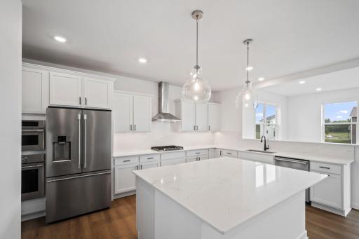 The spacious kitchen naturally serves as the heart of this home, complete with a generous center island, brand-new appliances and a walk-in pantry.