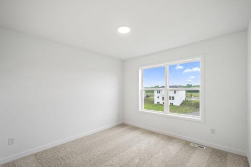 The secondary bedrooms provide comfort and privacy.