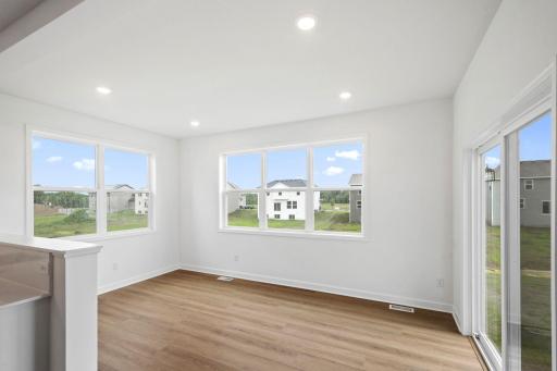 The morning room provides a sunlit space for meals of any kind, just off the kitchen.