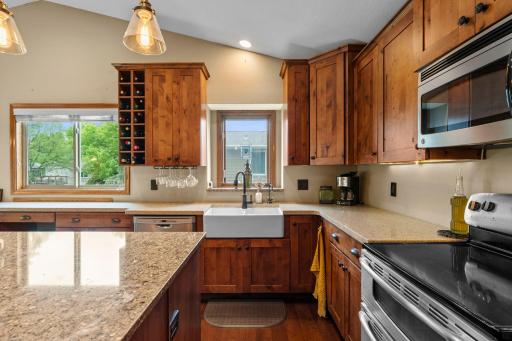 Kitchen has deep, ceramic tub sink with customer faucets