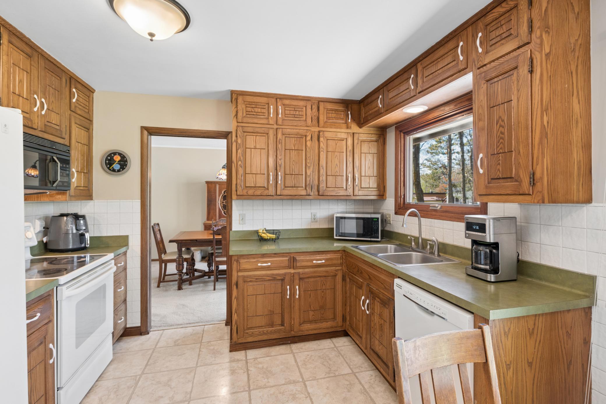 Enjoy doing the dishes while overlooking the beautiful backyard
