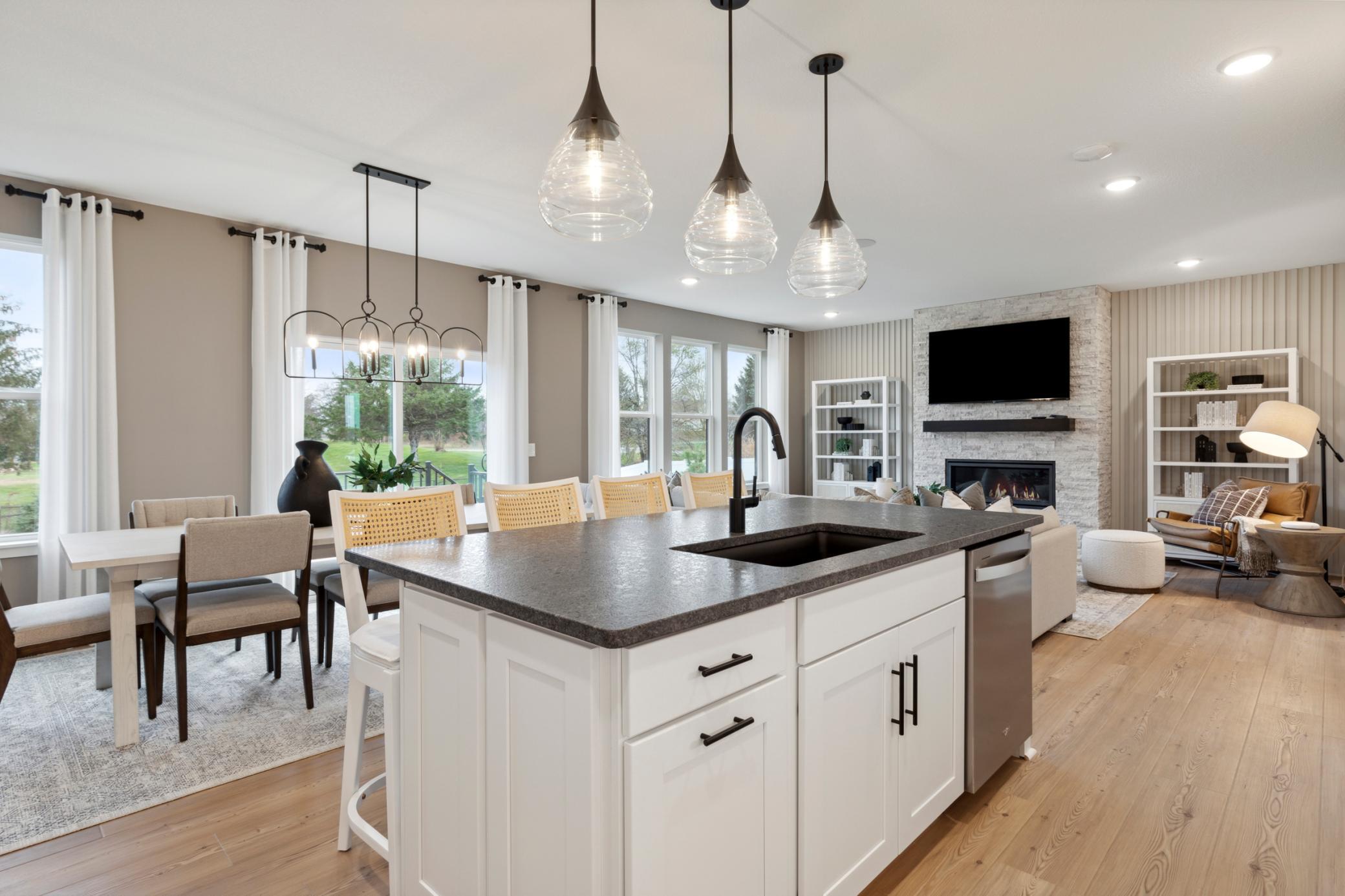 The convenience of the kitchen, cafe' and gathering room is amazing., a shown in our model home.