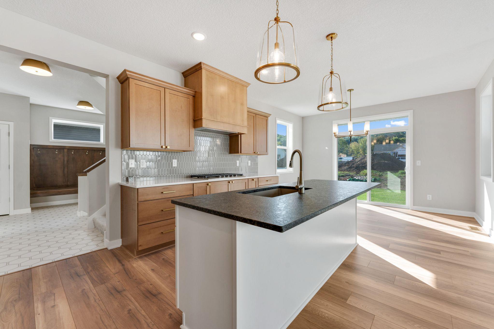 Beautiful mix of wood and white laminate cabinets with soft close doors and drawers.