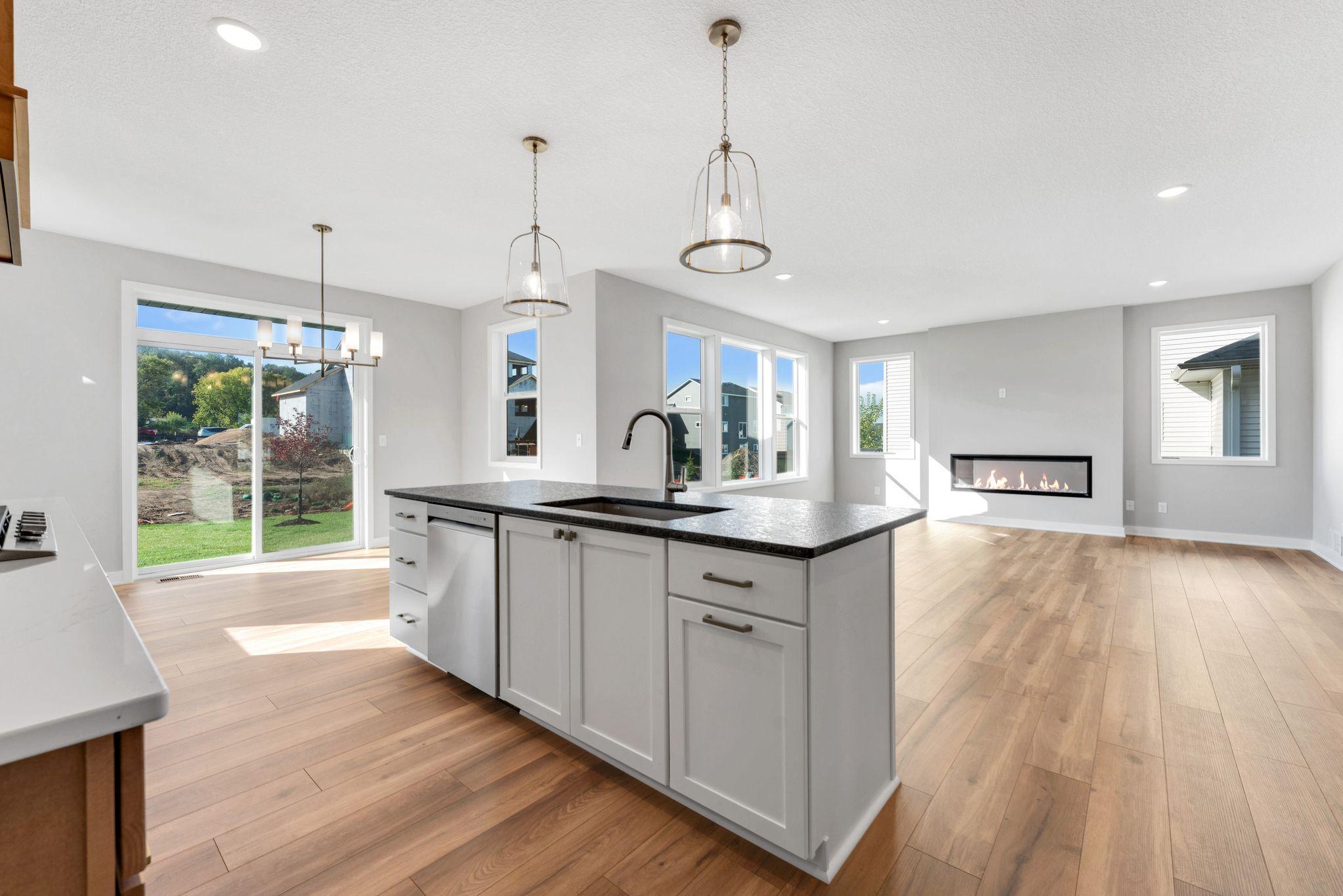 White laminate center island with granite countertop