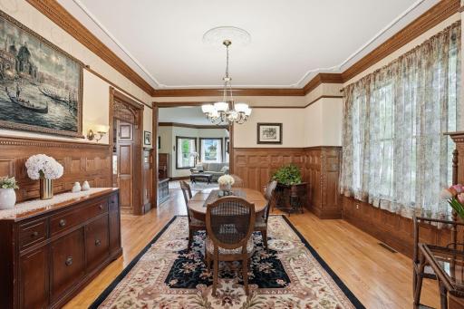 Wainscoting and crown molding give this dining room a luxe feel.