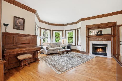 Sun-drenched living room with wood burning fireplace.