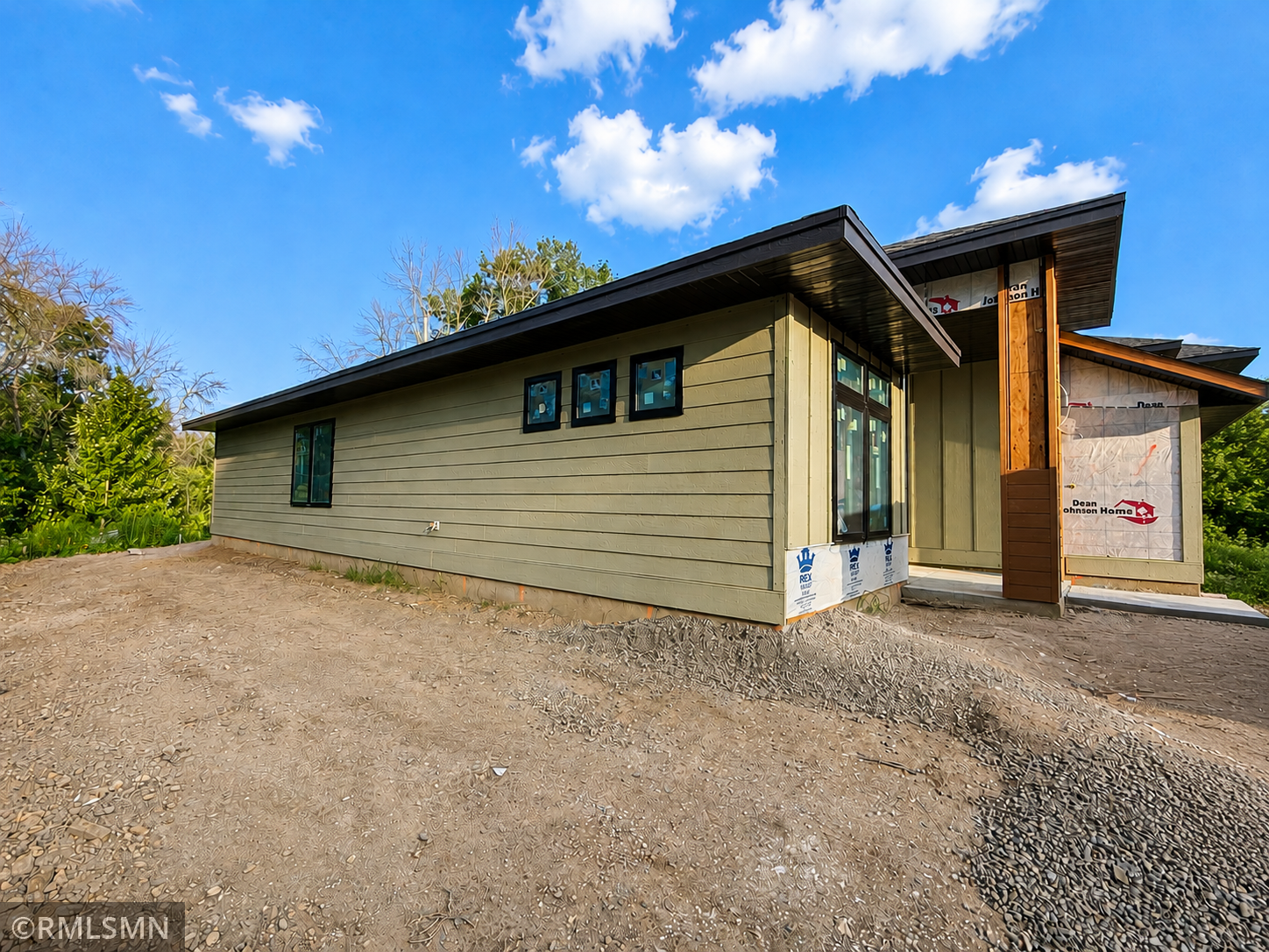 The side of this home is nice and private with views of trees, wet lands and nature!