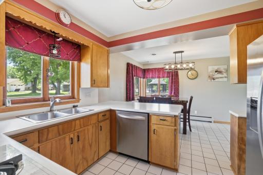Open kitchen with window overlooking the yard
