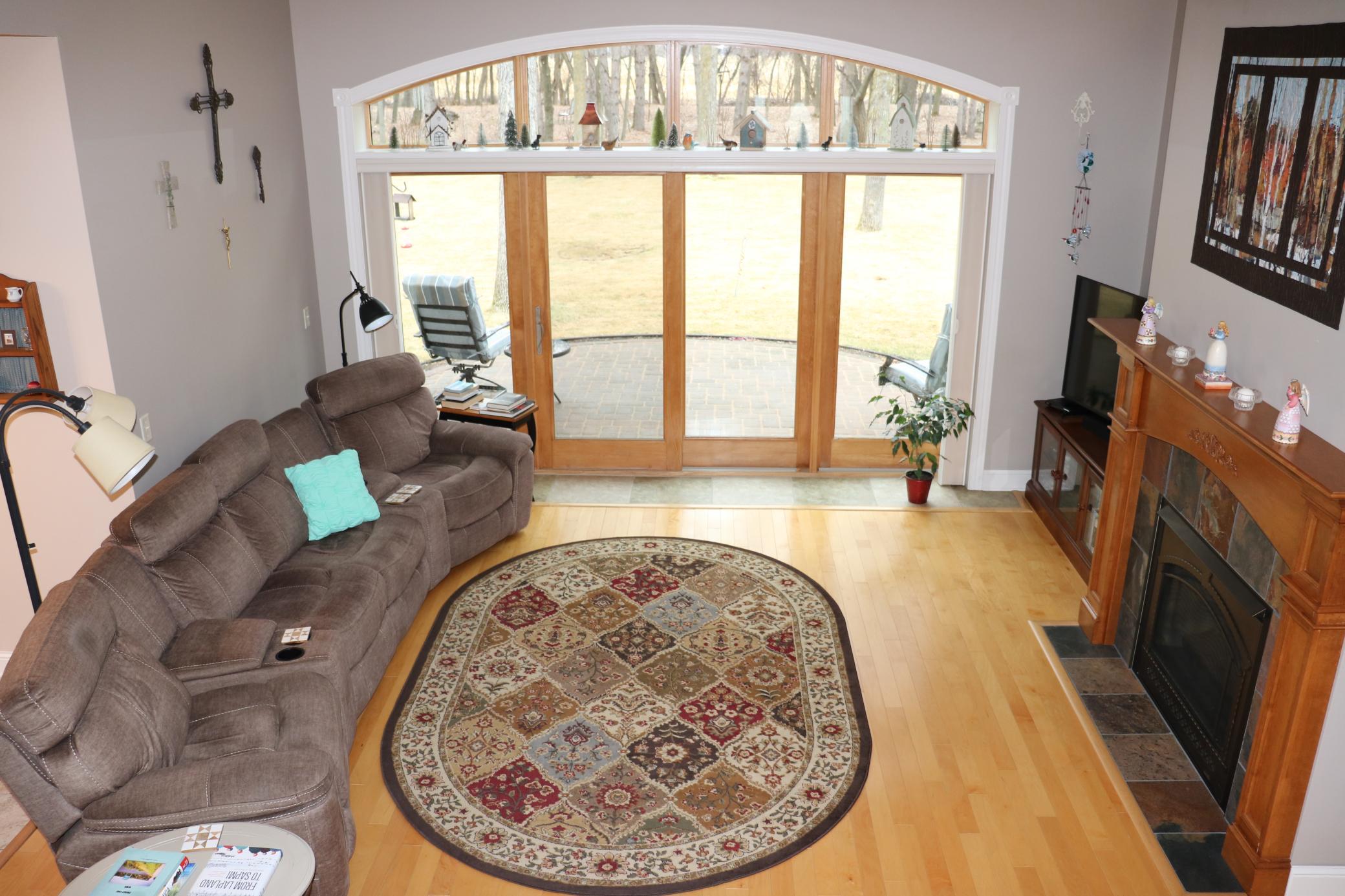 Patio/windows system have blinds that can keep the sun out.